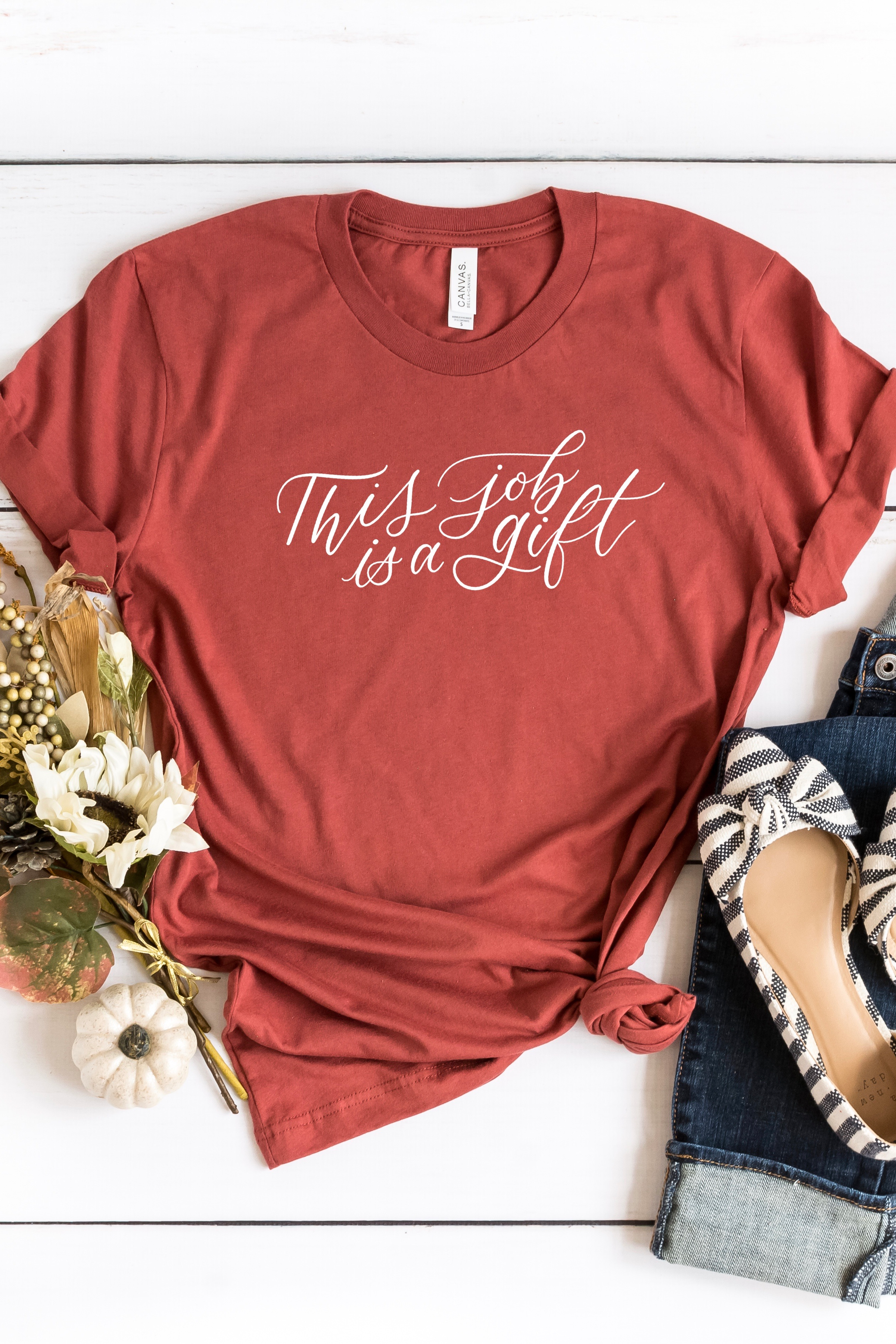 t-shirt that says, "this job is a gift"